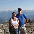 Photo of a couple at the top of Whistler's Mountain in Jasper, Alberta.
