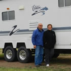 Alex and Irene Onody posing in front of their 2001 Citation Supreme RV.