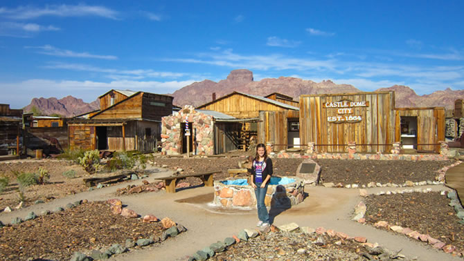 Haley Jones stands in front of the historic buildings of the old mining boom town of Castle Dome.