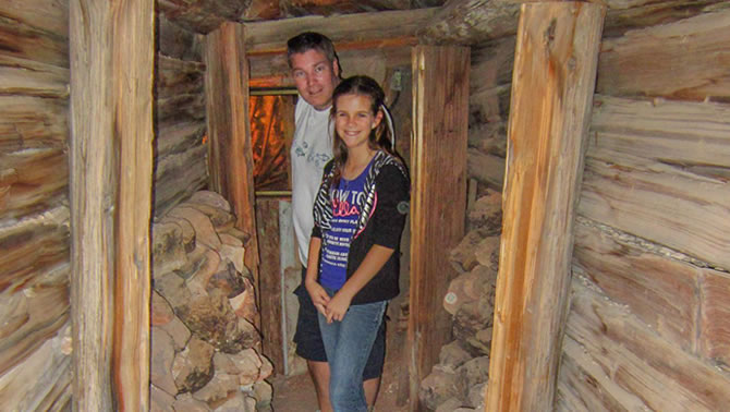 Haley and Glyn Jones explore an old mine tunnel of Castle Dome Mines Museum.