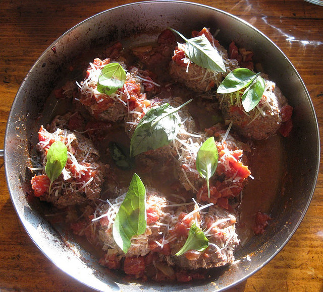 Meatballs in the frying pan, ready to add the tomato sauce.