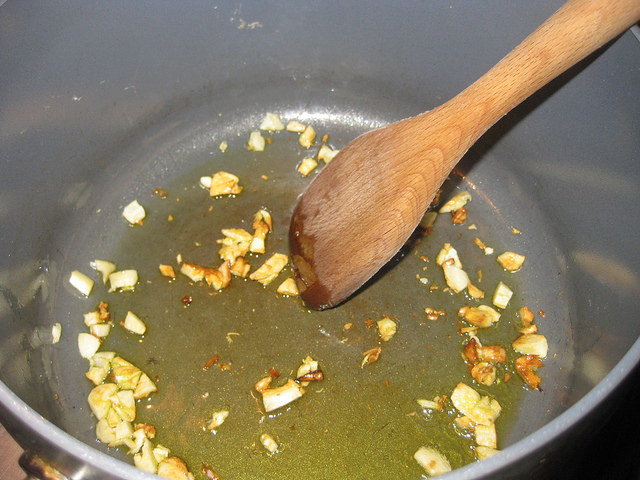 Step one: sauté  the garlic over med-high heat until the cloves are golden brown.