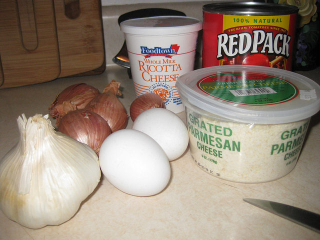 The ingredients needed to make Chads' meatballs; eggs, garlic, onions, ricotta cheese, parmesan cheese and tomato sauce. 