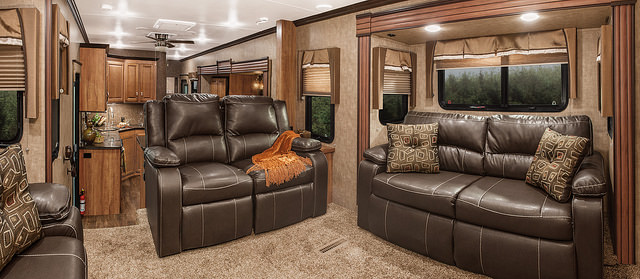 A view of the living room with two leather couches in the Durango Gold fifth wheel 