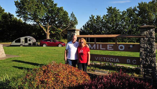 Oetter and Sommerfeld standing in front of  Mile Zero in Victoria, B.C. 