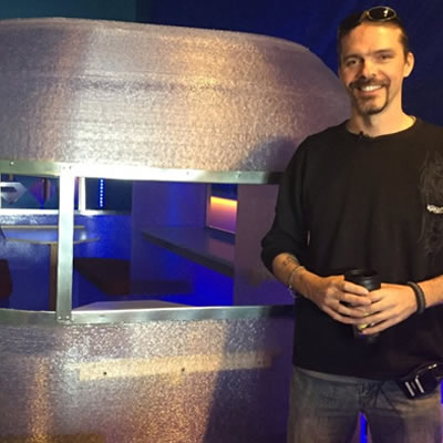 In this CTV News photo, Randy Janes poses in front of the world's first 3D-printed camper. He is the owner of Wave of the Future 3D and co-owner of Create Cafe based in Saskatoon, Sask.