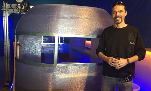 In this CTV News photo, Randy Janes poses in front of the world's first 3D-printed camper. He is the owner of Wave of the Future 3D and co-owner of Create Cafe based in Saskatoon, Sask.