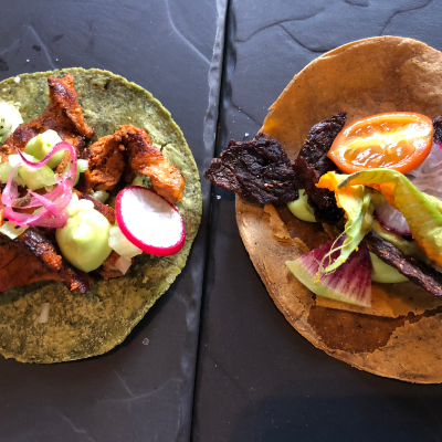 Two tacos are on display on a table