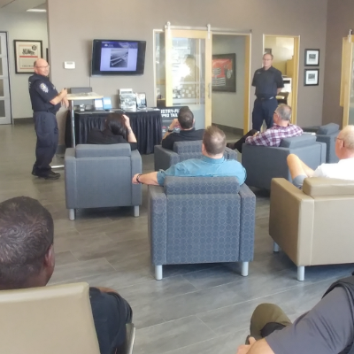 A room full of people listen to a presentation put on by the Ministry of Transportation’s Ernie Krause and Douglas Archibald at Northstar GM in Cranbrook, B.C.