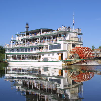 A riverboat sits on the water
