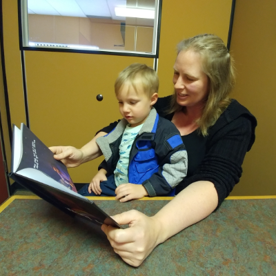 Michelle Forbes, author of Viking Lullaby, reads her book to her son, Jack. 