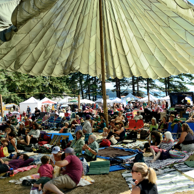 A unique cargo parachute sun/rain shade keeps the audience comfortable at the Sunshine Music Festival in Powell River, B.C. 