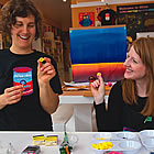 two female artists playing with some paints at 4Cats in Nelson, BC