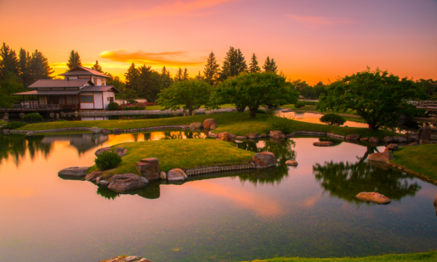 A beautiful pink sunset rests behind Nikka Yuko Japanese Gardens.