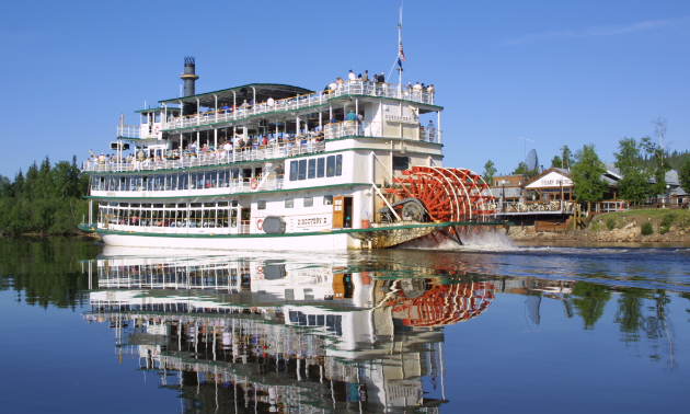 A riverboat sits on the water