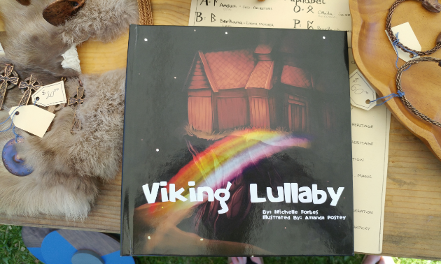 Viking Lullaby's cover shows a cabin in the sky with a rainbow bridge leading up to it