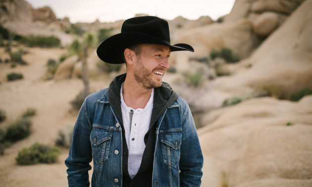 Paul Brandt smiles in the desert