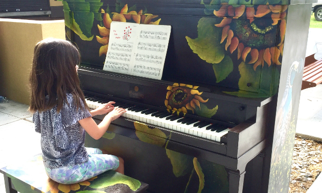 A child plays a piano