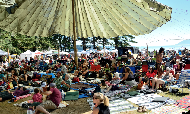 A unique cargo parachute sun/rain shade keeps the audience comfortable at the Sunshine Music Festival in Powell River, B.C.
