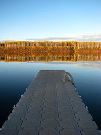 Picture of a wharf going out over a lake. 