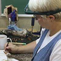 Kathy Phoenix carving a spotted sandpiper decoy. 