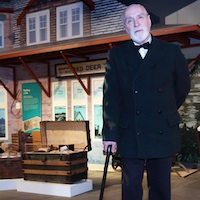 Rev. Leonard L. Gaetz (costumed interpreter) in front of the Red Deer Museum + Art Gallery train station.