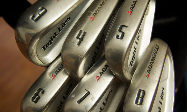 A beginner's set of Adams Tight Lie golf clubs