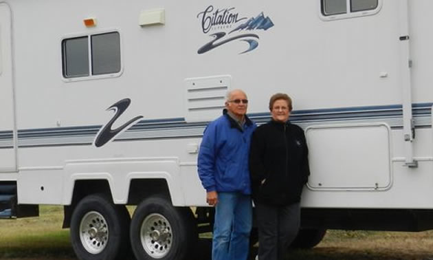 Alex and Irene Onody posing in front of their 2001 Citation Supreme RV.