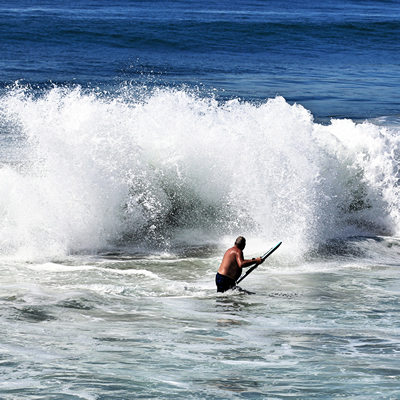 Dan Goy takes to the surf with his boogie board at Todos Santos.