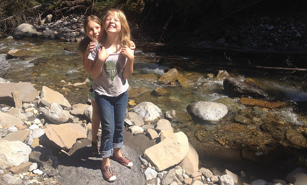 Michelle Carr's daughters standing next to Boulton Creek. 