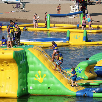 The Wibit, a floating yellow and green waterpark with trampolines, slides and other obstacles. 