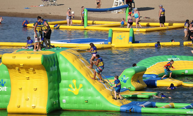 The Wibit, a floating yellow and green waterpark with trampolines, slides and other obstacles. 