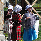 Three girls dressed in period costume at Historic O'Keefe Ranch