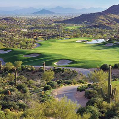 Overview of Desert Mountain Golf Club, showing the golf course and surrounding landscape. 