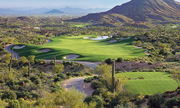 Overview of Desert Mountain Golf Club, showing the golf course and surrounding landscape. 