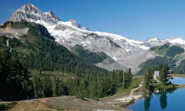 Scenic view of lake and mountains. 