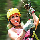 lady sliding down a zipline like the one that will be added in Fernie BC