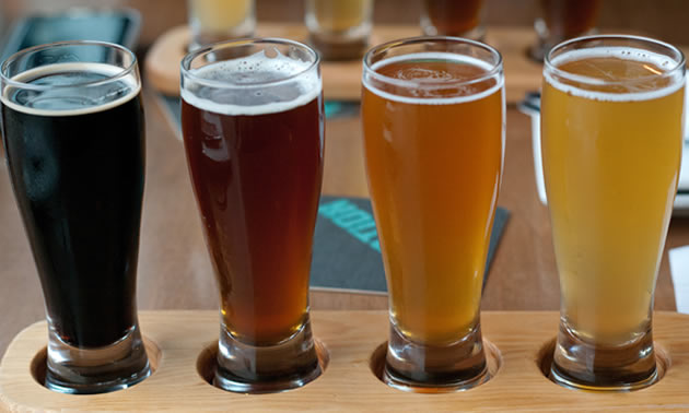 This sample flight includes (left to right) stout, red ale, IPA and a wheat beer, but drink these right to left.