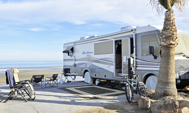 A photo of a motorhome parked on a beach in Mexico.
