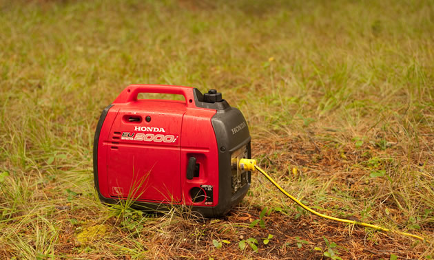 Picture of red and black Honda generator. 