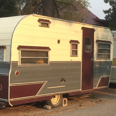 Picture of a Golden Falcon trailer on a street. 