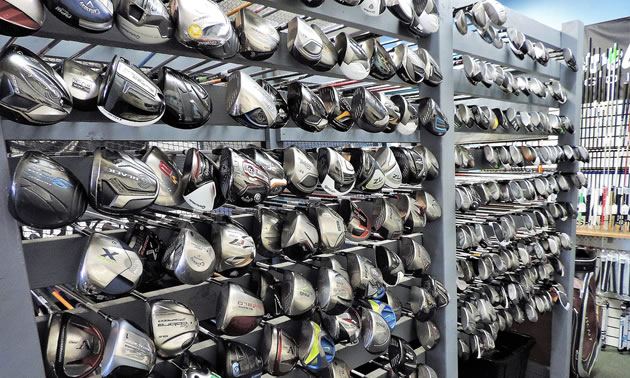 A large display of drivers and fairway clubs