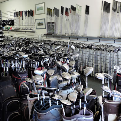 An inside view of the Arizona Golf Exchange with rows and rows of golf clubs and bags