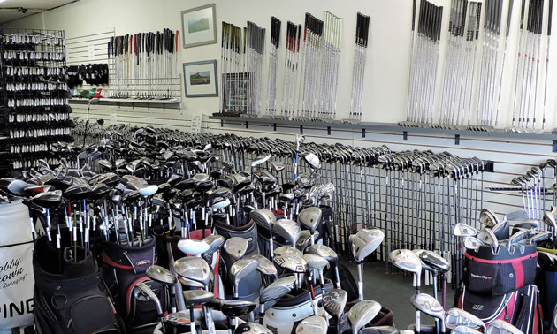 An inside view of the Arizona Golf Exchange with rows and rows of golf clubs and bags