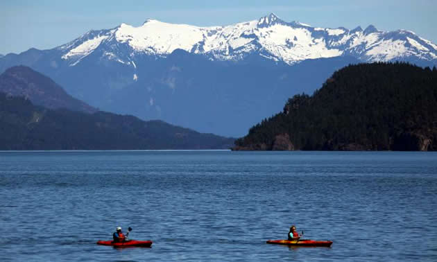 A couple of Kayakers on Harrison River in British Columbia.
