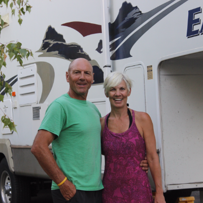 John and Shelley Smith stand proudly beside their 2006 28-foot Eagle fifth wheel.