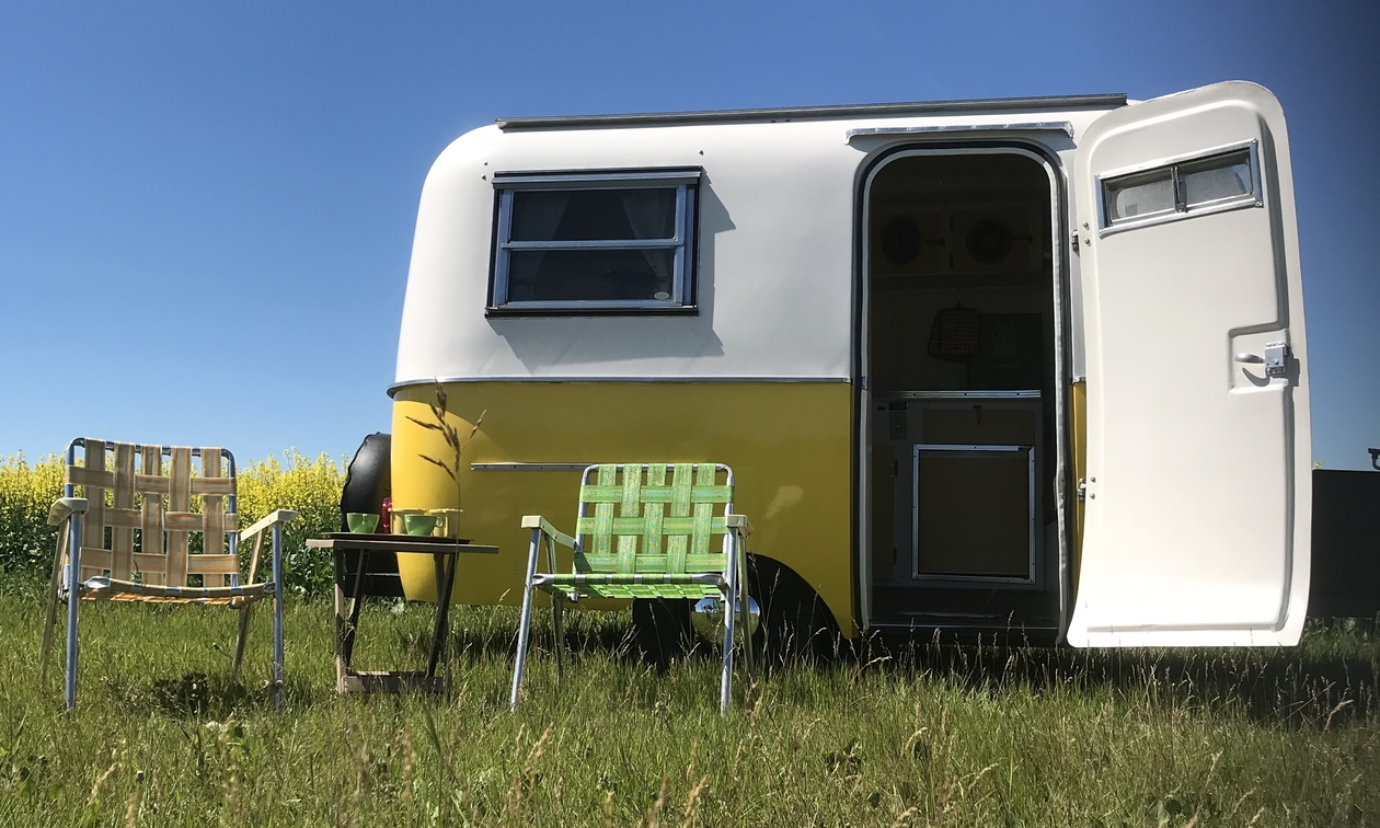 yellow boler with lawn chairs in front