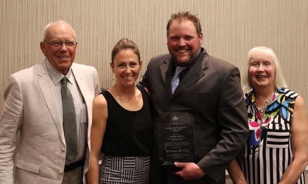 Jason Bell, surrounded by family, was awarded the Walter Paseska Memorial Canadian RV Dealer of the Year Award. 