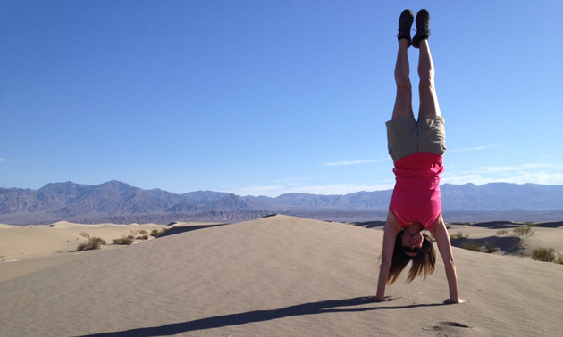 Janet doing a handstand at Death Valley National Park.