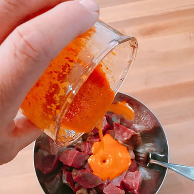 Tinned chipotle peppers blend with olive oil for a creamy and spicy marinade.